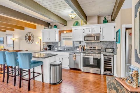 Kitchen: Drip coffee maker, toaster oven, cooking utensils, tableware