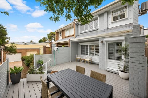 Welcome to your beachside retreat—relax on the front deck before heading out for a swim just five minutes away.