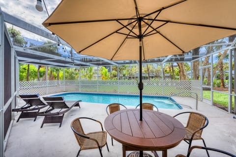 You'll sink into island-time by the screened, heated pool as canal breezes drift by.