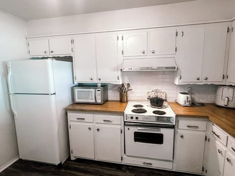 Fully stocked kitchen with all essentials, keurig coffee station, and basic cooking spices and oil