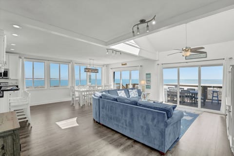 Large sectional with sleeper sofa and sliders from living room and dining room. 