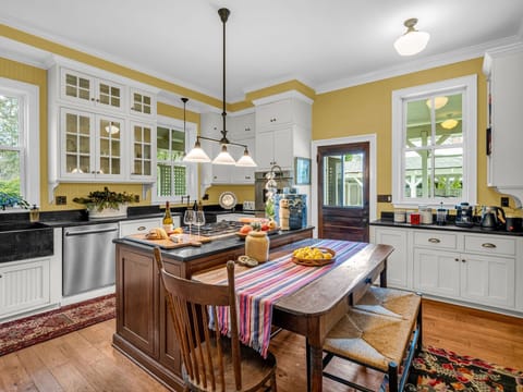 Updated kitchen at Killarney House featuring modern appliances within a historic setting.