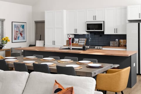 Fully equipped large kitchen with everything you need, featuring beautiful wood countertops—ideal for cooking and entertaining