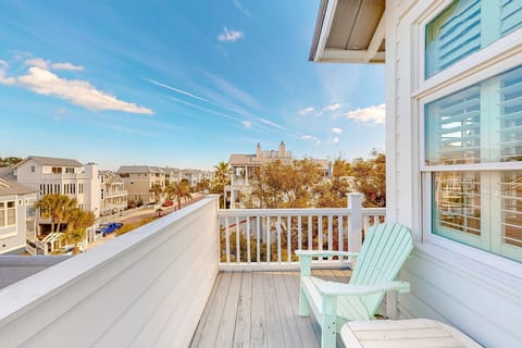 Enjoy this beach view from the top floor balcony of this home