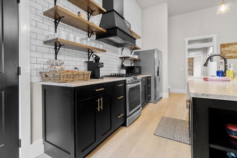 Fully stocked open concept kitchen, located on the entry level