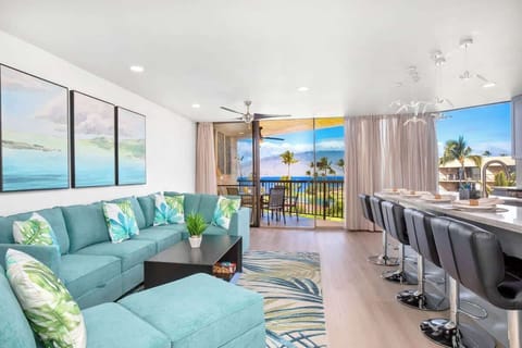 Experience oceanfront luxury with vibrant, tropical decor and a seamless transition to a stunning view from your private lanai in this beautiful, fully renovated condo!