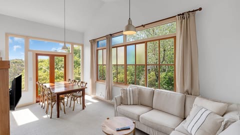 Light filled living and dining room with views of the National Park