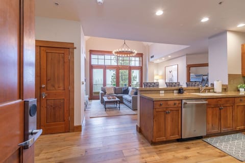 Step into your spacious mountain retreat where rich wood finishes and modern amenities create the perfect blend of rustic charm and contemporary comfort for your getaway.
