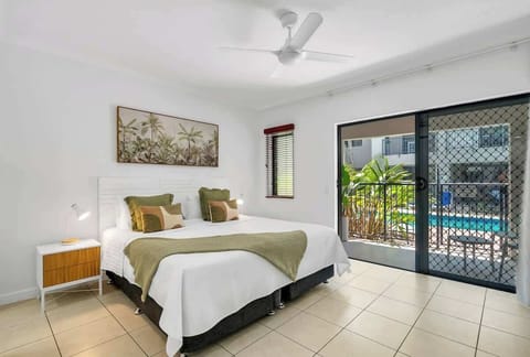A bright, thoughtfully styled sleeping area offers comfort after a day exploring the coast.