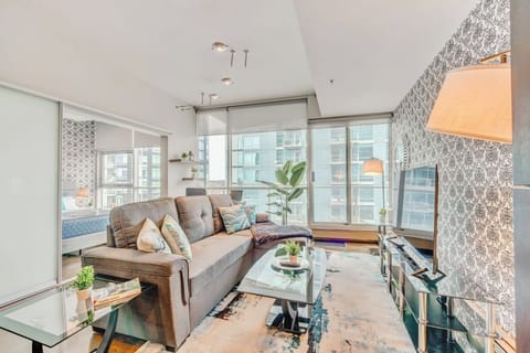 Bright And Cozy Living Room With Smart TV For Your Entertainment