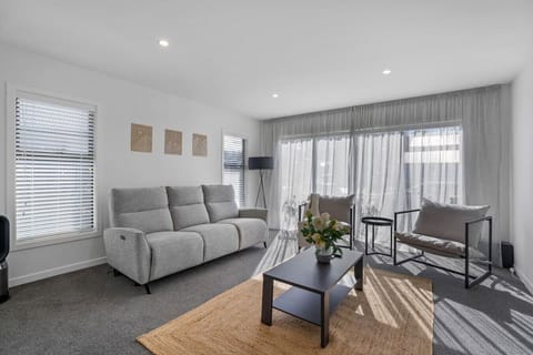 Warm, sunny living room with heat pump + panel heater.