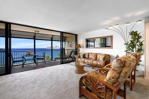Living Room Offers Floor to Ceiling Doors that Offer Ocean Views