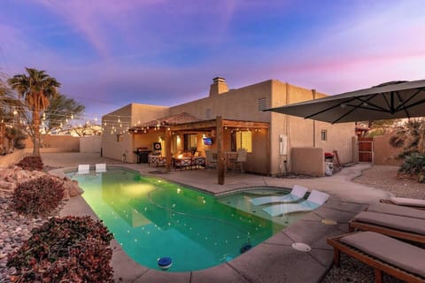 Private pool oasis with beautiful sunset views and cozy outdoor seating.