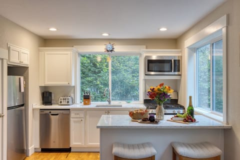 A bright, well-appointed kitchen perfect for preparing a delicious meal.