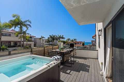 Soak in the sunshine from your private deck, complete with a bubbling hot tub, grill, and peek-a-boo ocean views.