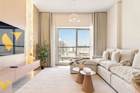 Luxury Apartment, Balcony, City View | Living area | 65-inch Smart TV with cable channels