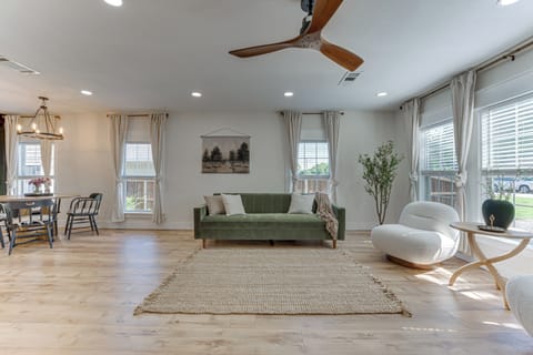 Bright open-concept living space with cozy seating and natural light