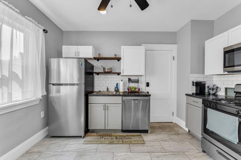 Bright, simple kitchen offering everything within easy reach.