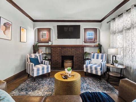 Comfortable living area w/ plush seating & bright windows