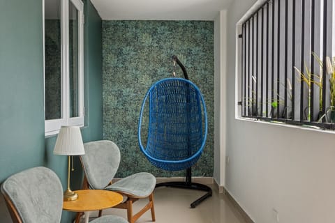 Balcony style seating area, entrance to the unit