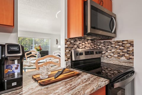 Kitchen | Fully equipped with stainless steel appliances and ample counter space