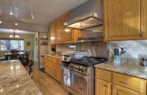 Bright kitchen and dining area that keeps everyone connected while cooking.