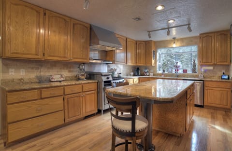 Bright kitchen and dining area that keeps everyone connected while cooking.