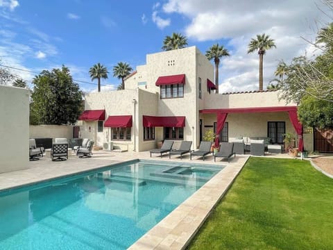 Spectacular peaceful & private backyard with refreshing pool, an integrated spa, a fire pit, BBQ grill, and multiple outdoor living spaces. Perfect for a rejuvenating retreat.