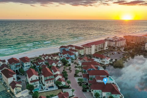 Grits Carlton—your luxury coastal escape that SLEEPS 15! Steps to PRIVATE beach access. Enjoy the lakefront deck, HEATED splash pool, outdoor dining, and gorgeous views. The perfect spot for unforgettable beach vacations!
