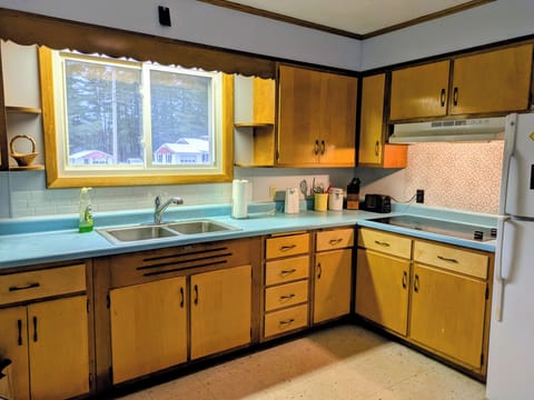 Convenient kitchen, well stocked with basic pots, pans, dishes and utensils