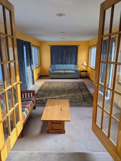 Bonus room off the living room features a sofa bed