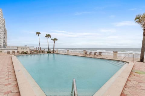 Enjoy resort-style relaxation at the beachfront pool overlooking the ocean. Lounge poolside, soak up the sun, and take in breathtaking coastal views during your unforgettable beach stay just steps from the sand.