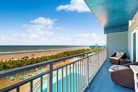 Relax on a private oceanfront balcony overlooking the pool and sandy shoreline. This beach stay offers stunning coastal views, fresh sea breezes, and the perfect spot to unwind just steps from the beach.