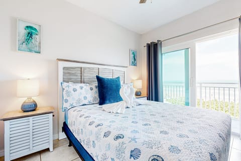 Unwind during your beach stay in this serene ocean-view bedroom featuring coastal décor, plush bedding, and private balcony access. Wake up to sea breezes and soothing shoreline views just outside your door.