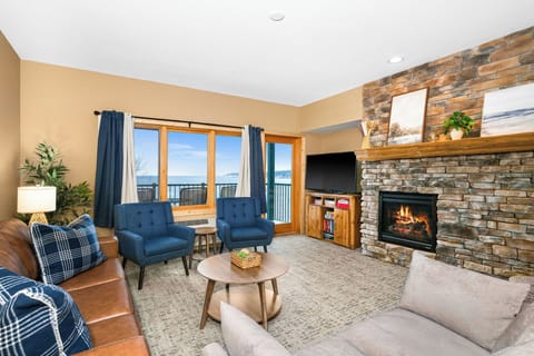 Living room with fireplace, TV, books, games