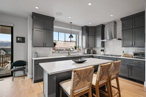 The kitchen is large with a generous island, bar seating and juts about every amenity you could need to prepare a large meal for your group