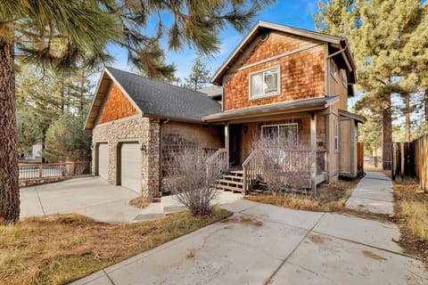 Scenic street framed by tall palms and distant hillside views, offering a picturesque and tranquil neighborhood setting