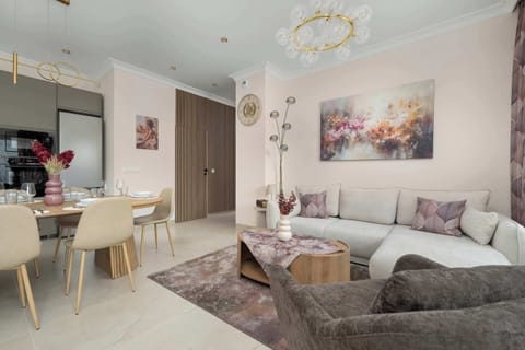 Relax in the stylish living room with a comfortable sofa and modern decor.