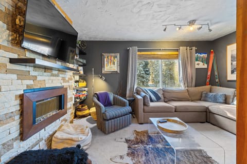 Living Room - Lounge around on our comfy down sofa by the electronic fire