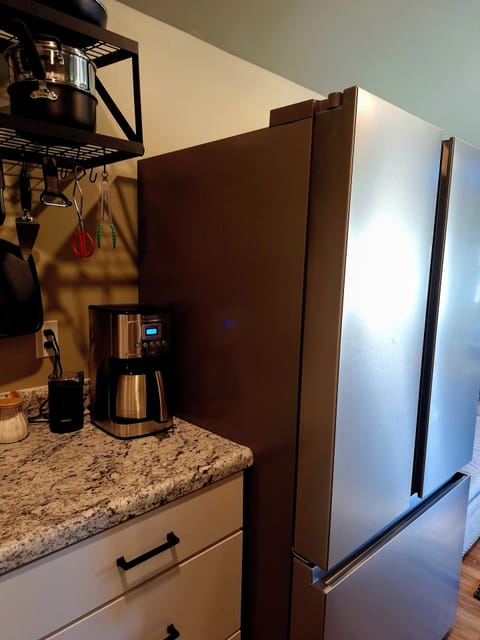 Full-size refrigerator w ice maker and filtered water just inside the door.