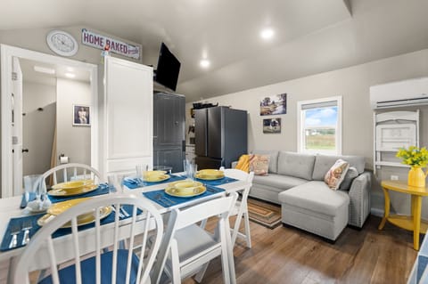 Table expands to accommodate 5  and couch expands to bigger than twin size.