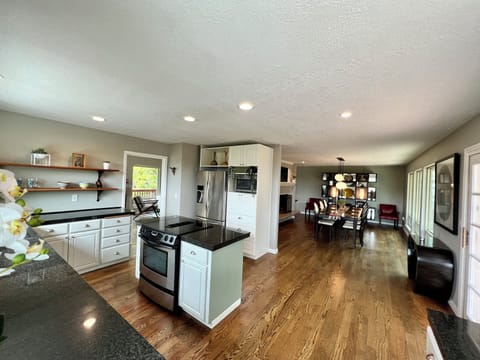 Open floor plan with abundance of natural lighting and space to host or entertai