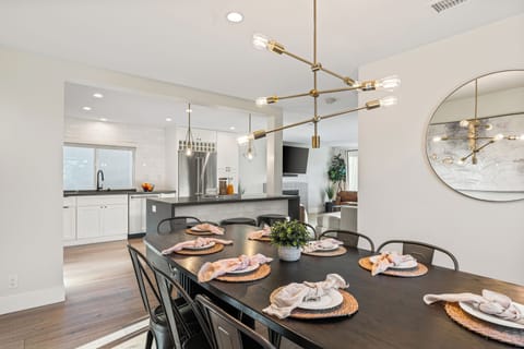 Unit 1: Dining table set with stylish pendant lighting.