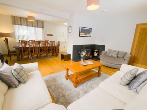 Warm living area with log burner perfect for family nights or group catch-ups.