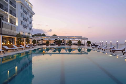 Outdoor pool, pool umbrellas, sun loungers