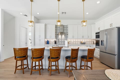 Cook and dine comfortably in the full kitchen with island seating. Enjoy a thoughtful welcome basket with coffee, chocolates, dishwasher pods, and helpful guide! 