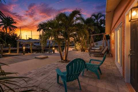 Evening settles over your tropical retreat, where swaying palms, waterfront views and island skies create the perfect backdrop for a relaxing getaway.