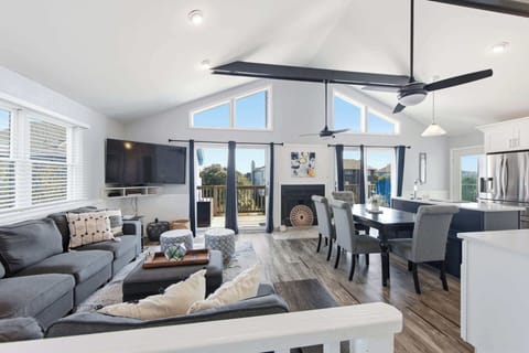 A bright, open-concept kitchen with modern finishes and full amenities - perfect for cooking, gathering, and entertaining during your vacation stay.