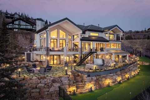 Exterior: Deck with outdoor seating, forest views, bistro lighting