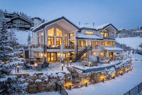 Exterior: Deck with outdoor seating, forest views, bistro lighting